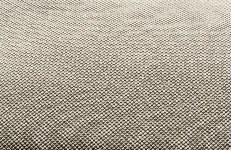 Textured woven fabric close-up — illustrative material specification image